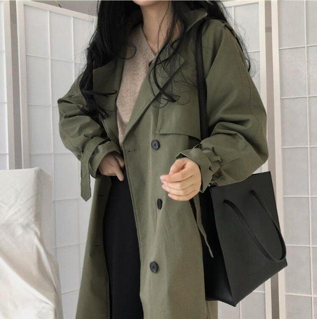 Women’s army green long windbreaker with hood, button front, and flap pockets