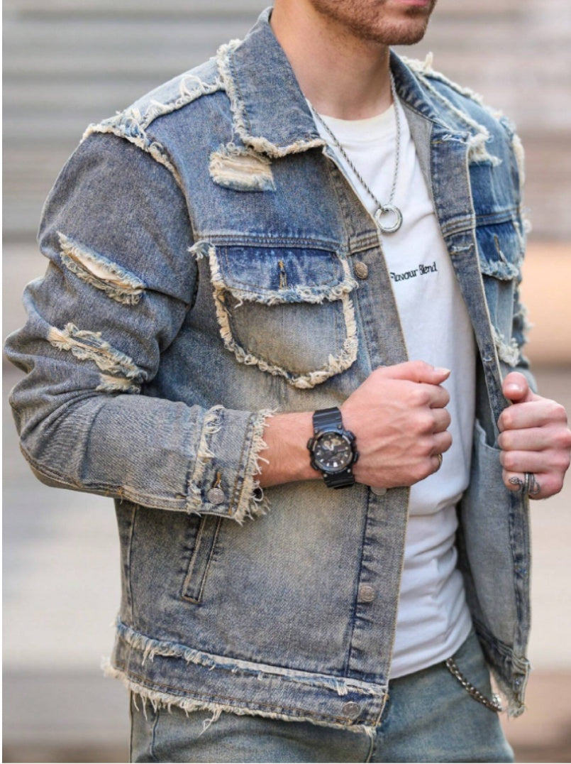 Light blue distressed denim jacket with patchwork pockets and frayed cuffs