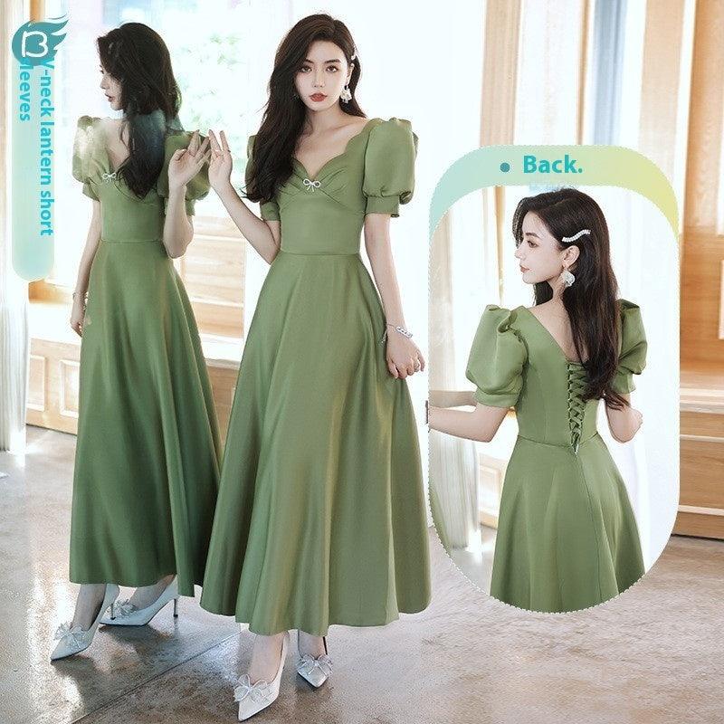 Green midi dress with puff sleeves, sweetheart neckline, and button front bodice