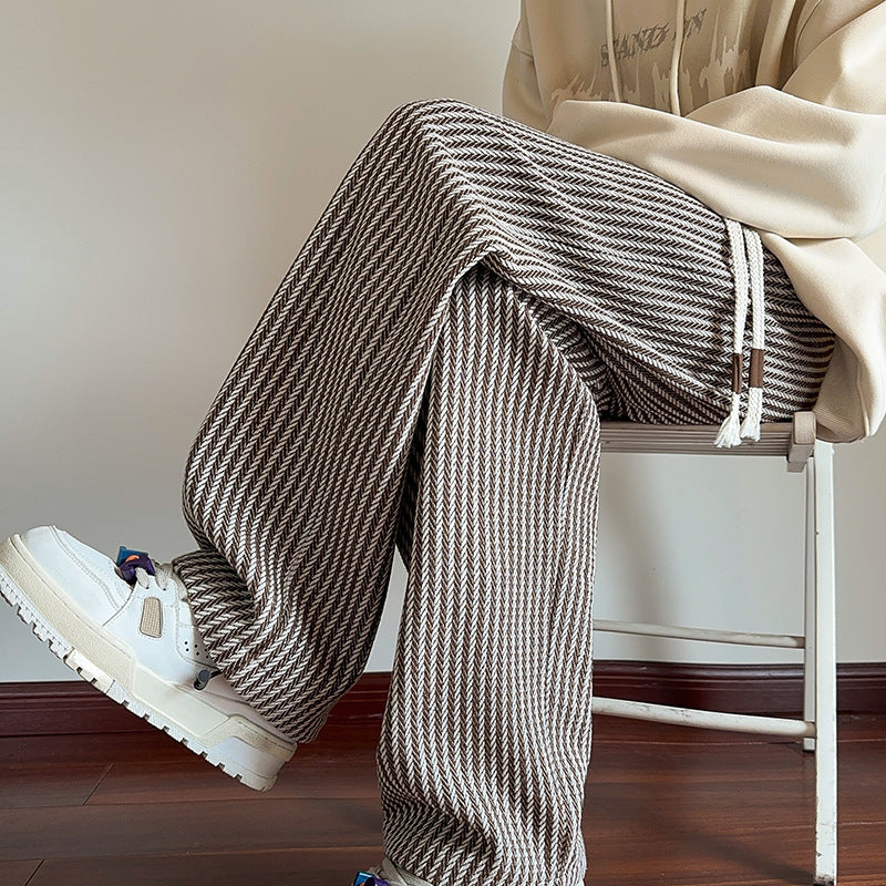 Men's wide-leg trousers in black-and-white check herringbone pattern