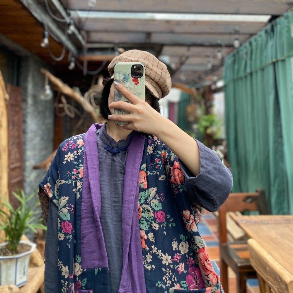 Long quilted waistcoat in navy floral with purple contrast edging, draped open front