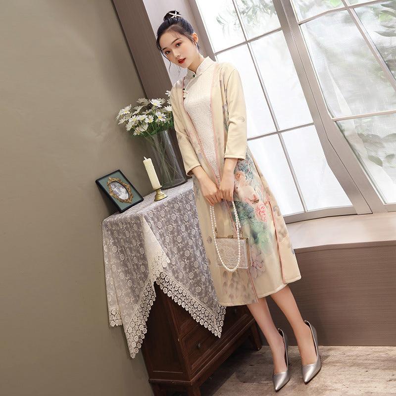Champagne/beige cheongsam-style dress with blue trim and floral print, three-quarter sleeves