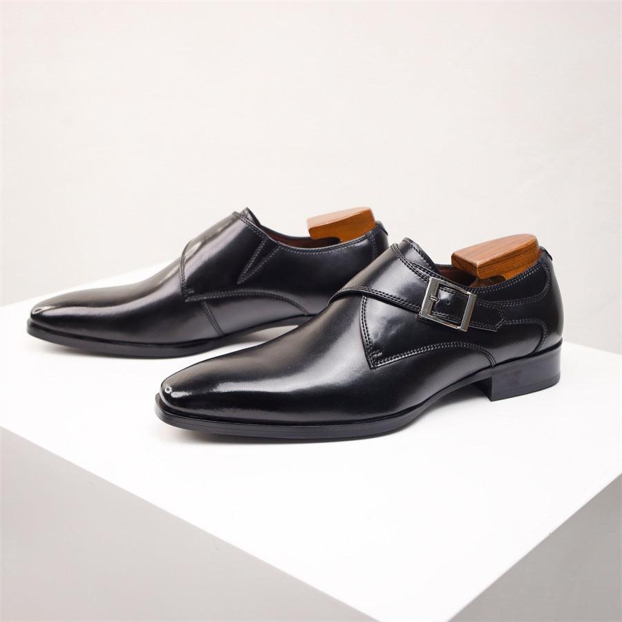Men's black leather dress shoes with side buckle strap and rounded toe.