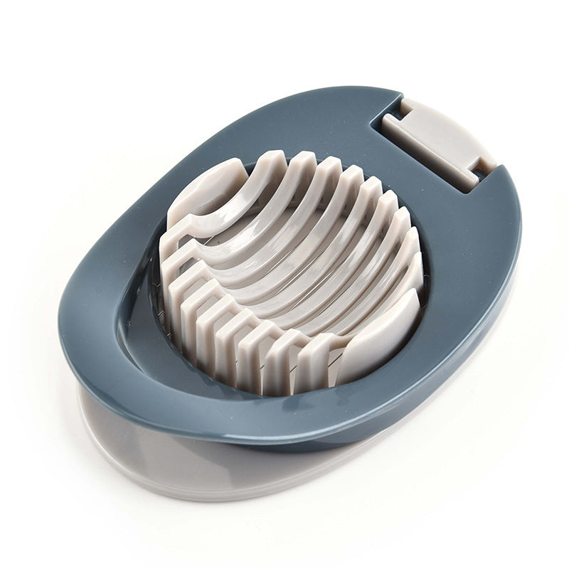 Grey-blue egg slicer base with white wire cutting grid and open top ring