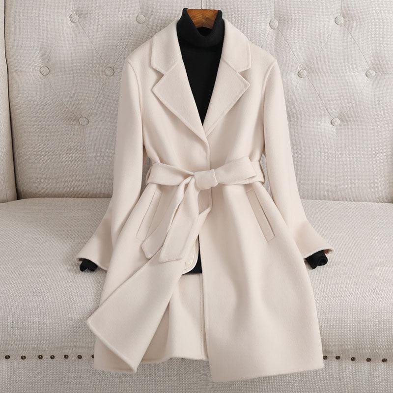 Ivory double-breasted cashmere coat with notched lapels and waist tie belt