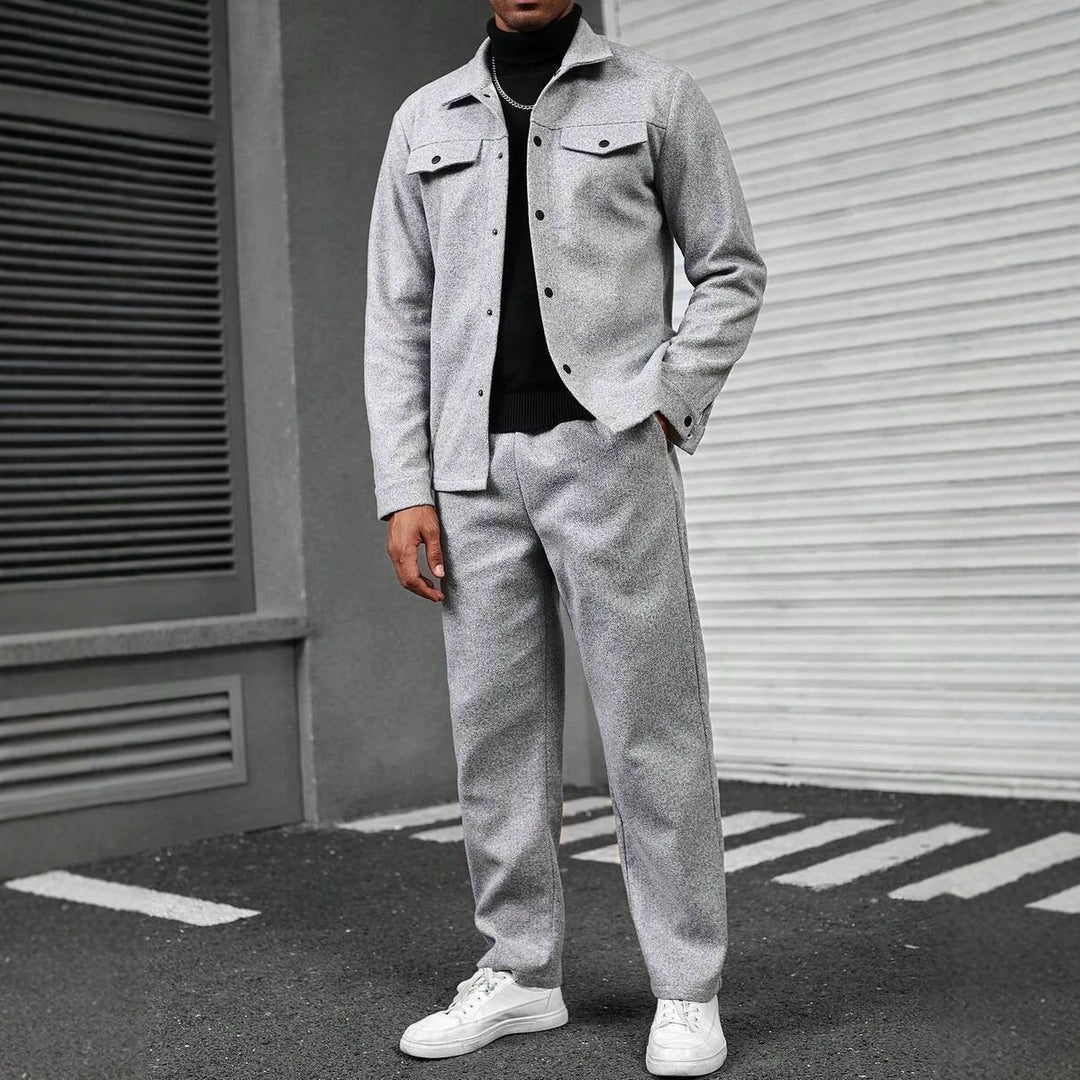 Men's light gray jacket and loose-fit trouser set with chest pockets and buttons