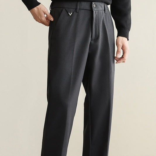 Dark textured suit pants with single pleat front and elastic waist, side pockets