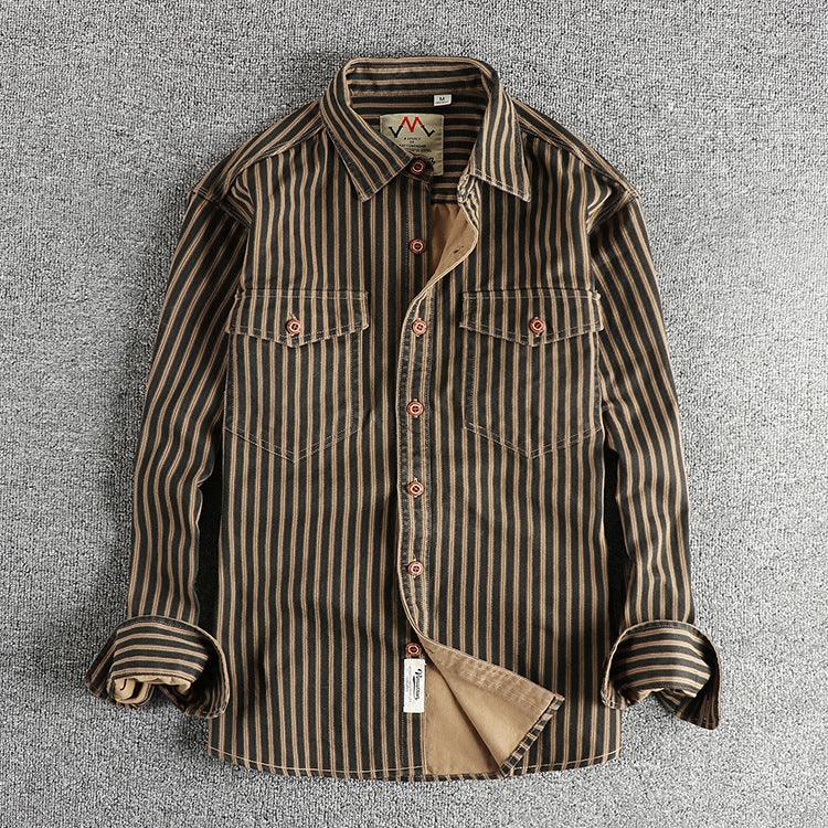 Front view of dark-striped long-sleeve button-up shirt with chest pockets and rolled cuffs