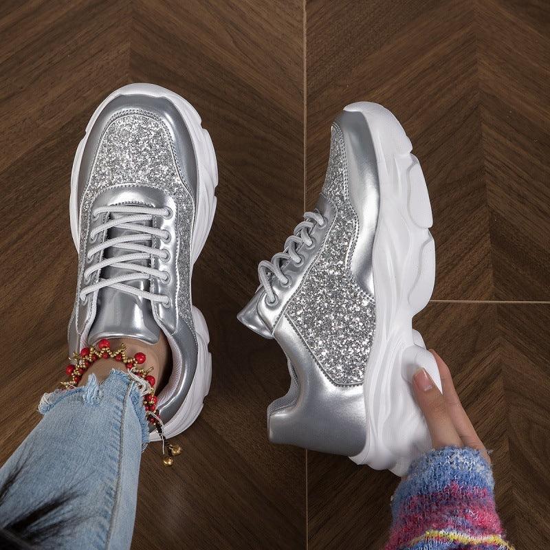 Silver glitter lace-up running sneakers with white chunky sole, round toe