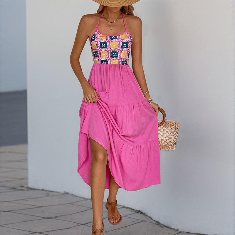 Rose red halter sundress with colorful square print bodice, draped skirt, and side slit