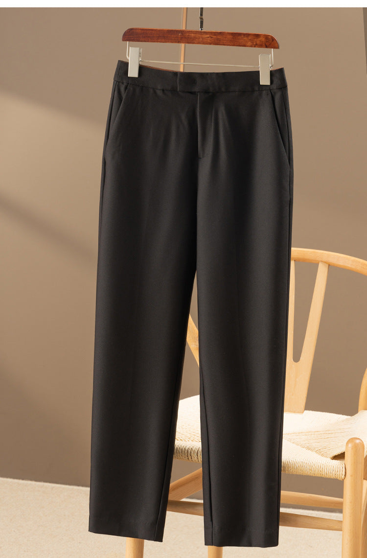 Black nine-point tapered dress pants with waistband and ankle-length straight leg