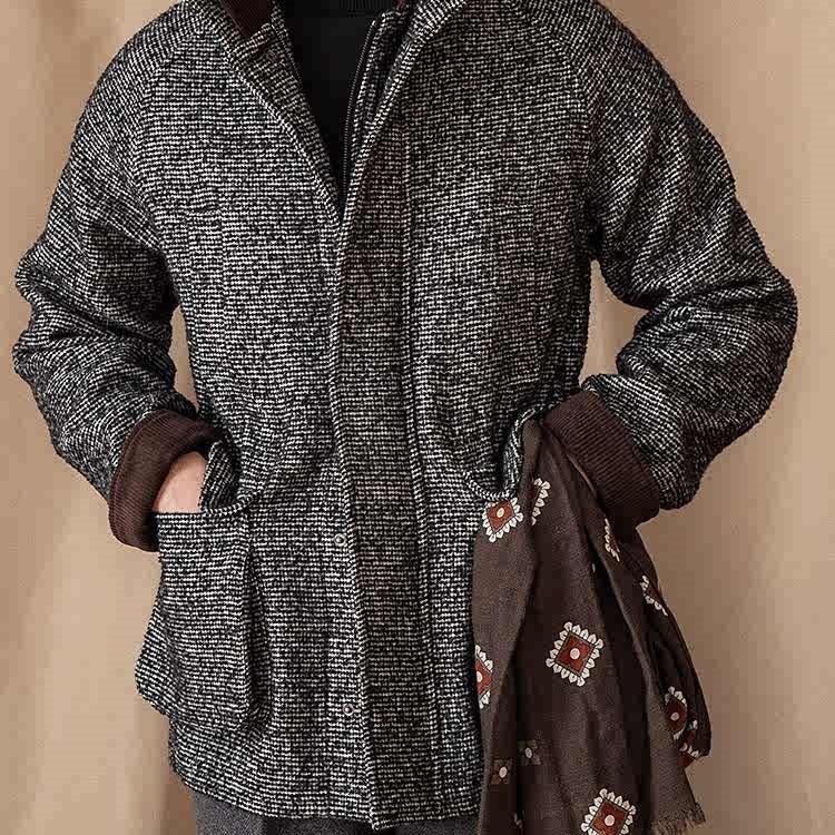 Men's wool winter coat with zip front, dark brown collar and cuffs, textured black knit.