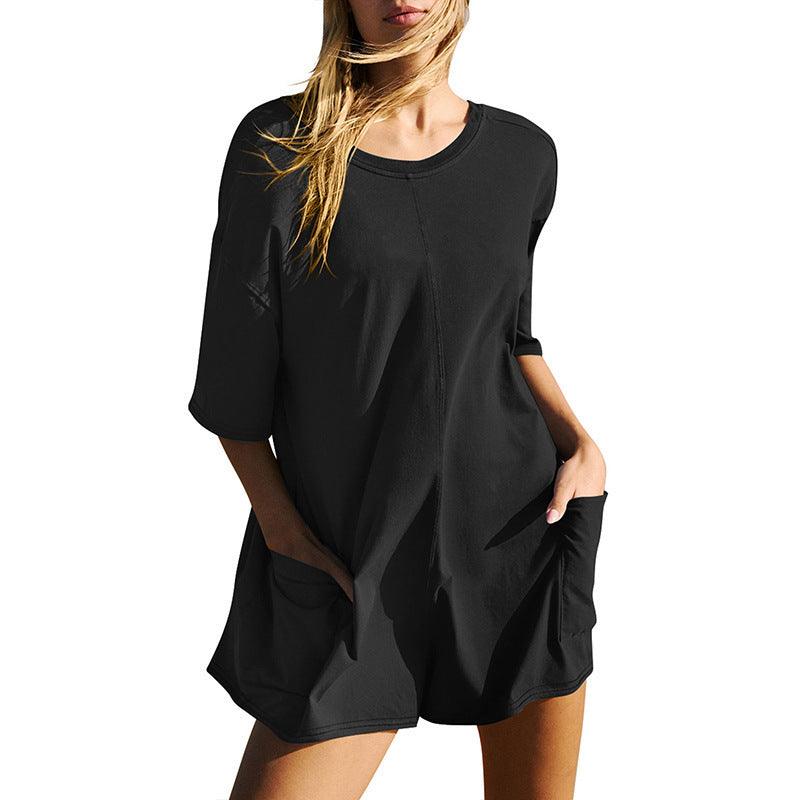 Black loose short-sleeve jumpsuit with scoop neck and side pockets