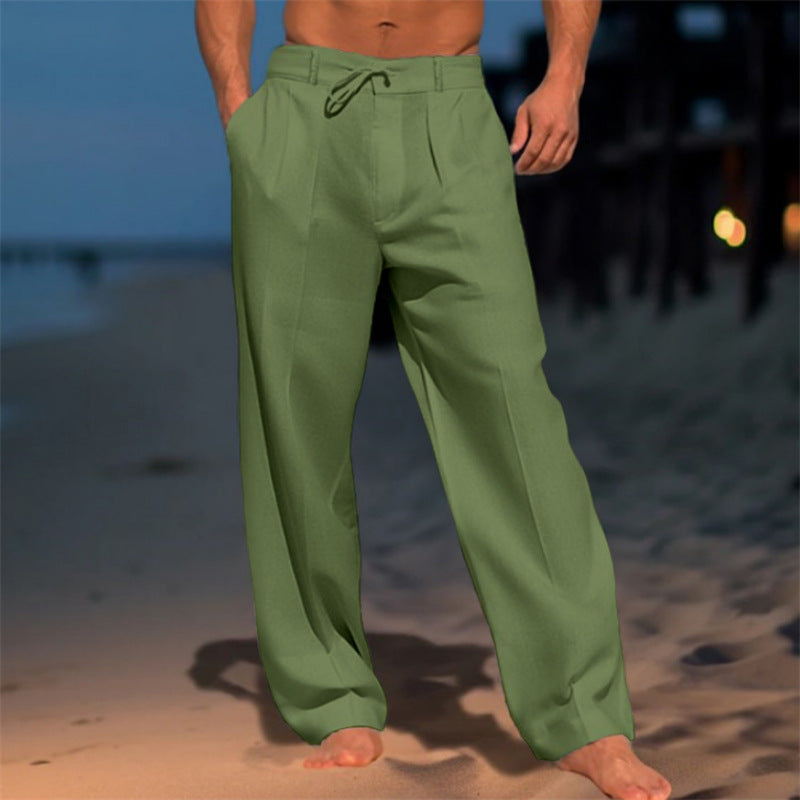 Men's green drawstring lounge pants with elastic waistband and relaxed straight legs.