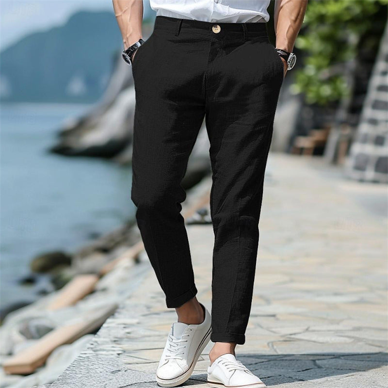Men's linen trousers in black with button front, slant pockets, straight-leg