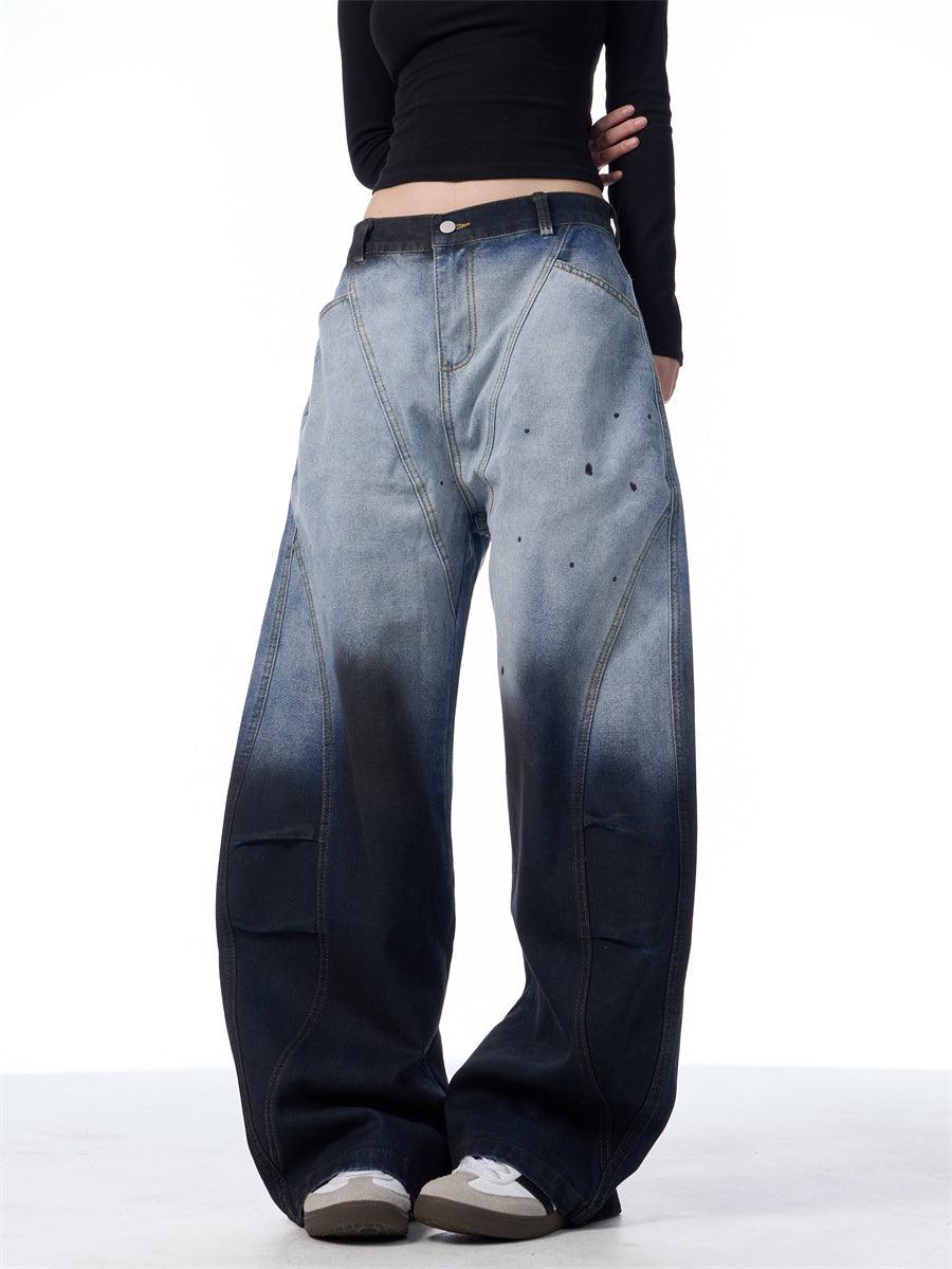 Women’s blue wide-leg jeans with dark side patches, button closure, and speckle print