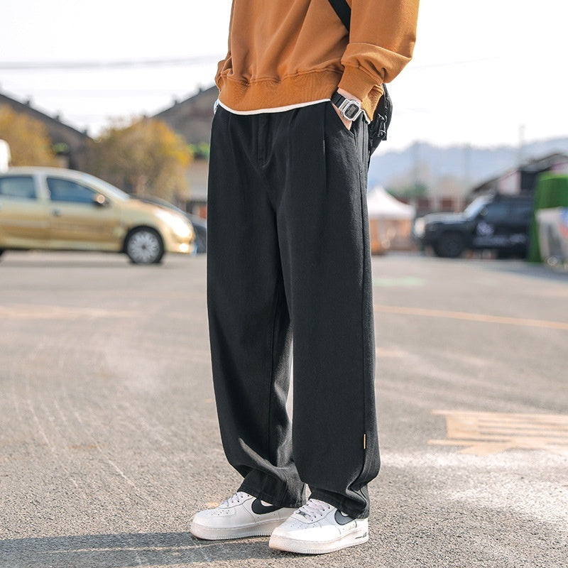 Men's loose cargo pants in dark charcoal, straight leg, cuffed hems, cargo pocket look