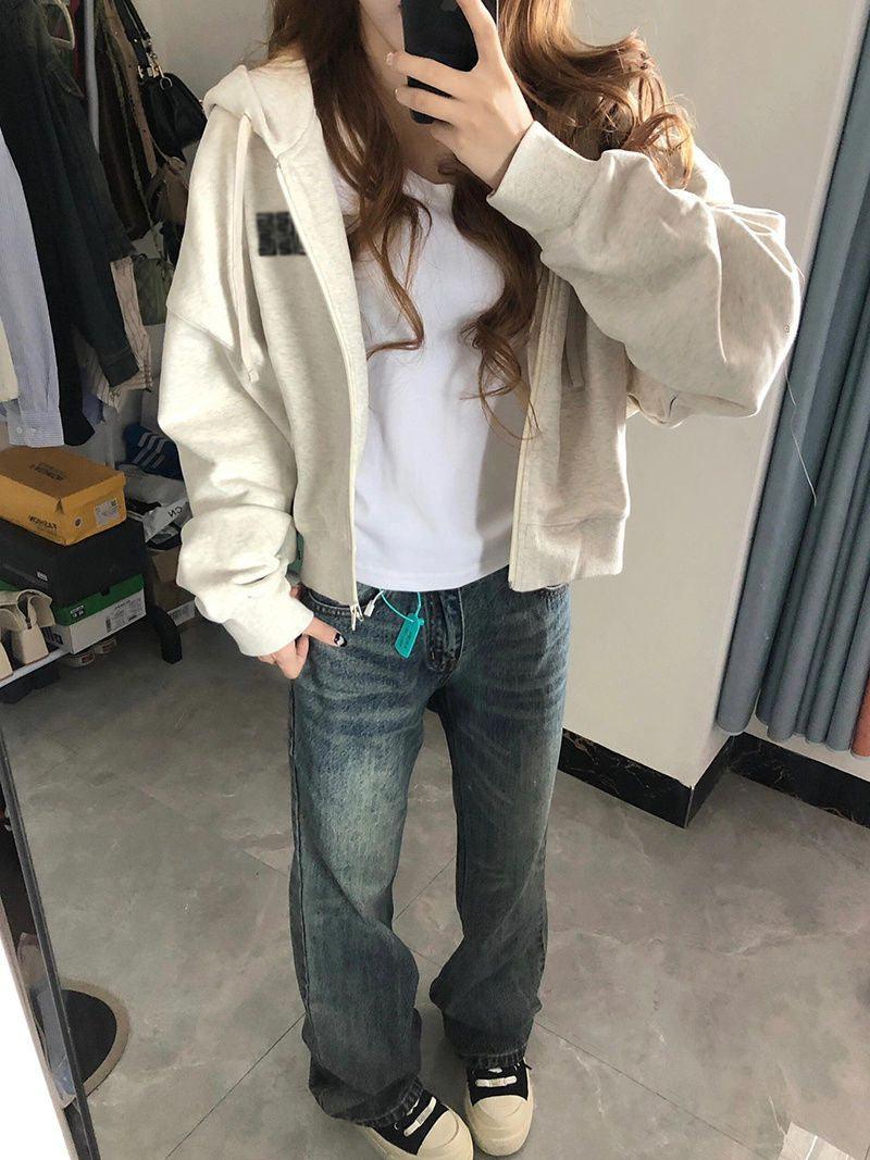 Cream hooded cardigan sweater with front zipper, long sleeves, and casual fit