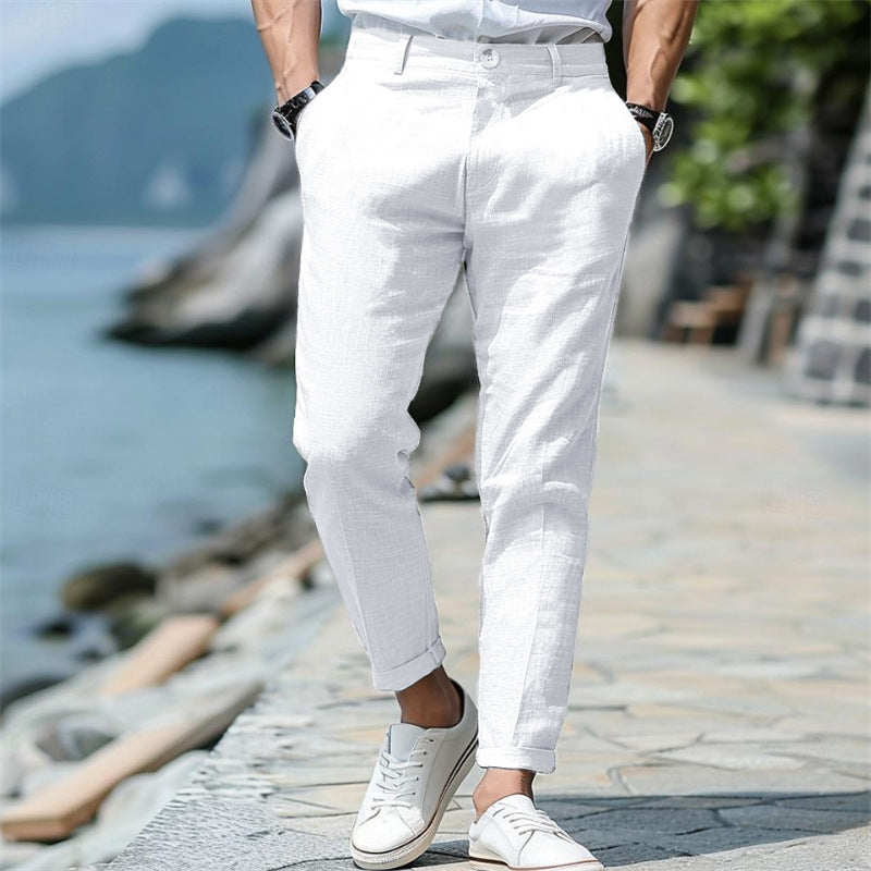 Men's linen trousers in white with button front, slant pockets, straight-leg