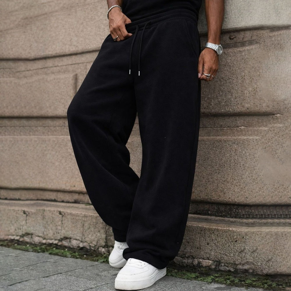 Fleece-lined loose sweatpants with elastic drawstring waist, dark navy/black, relaxed fit
