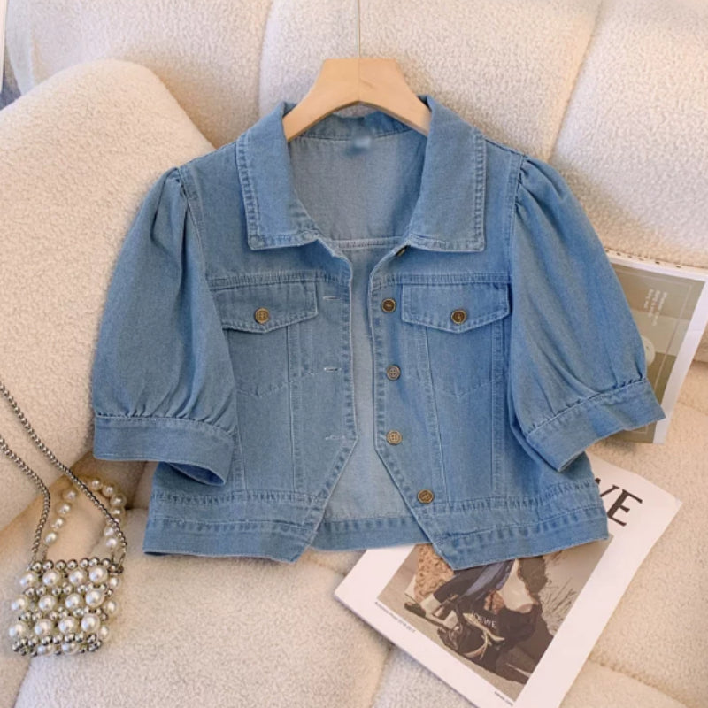 Blue denim cropped jacket with button front and two flap chest pockets