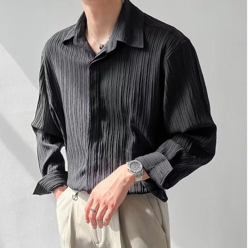 Men’s long-sleeve loose shirt in black with vertical striped texture and button placket.