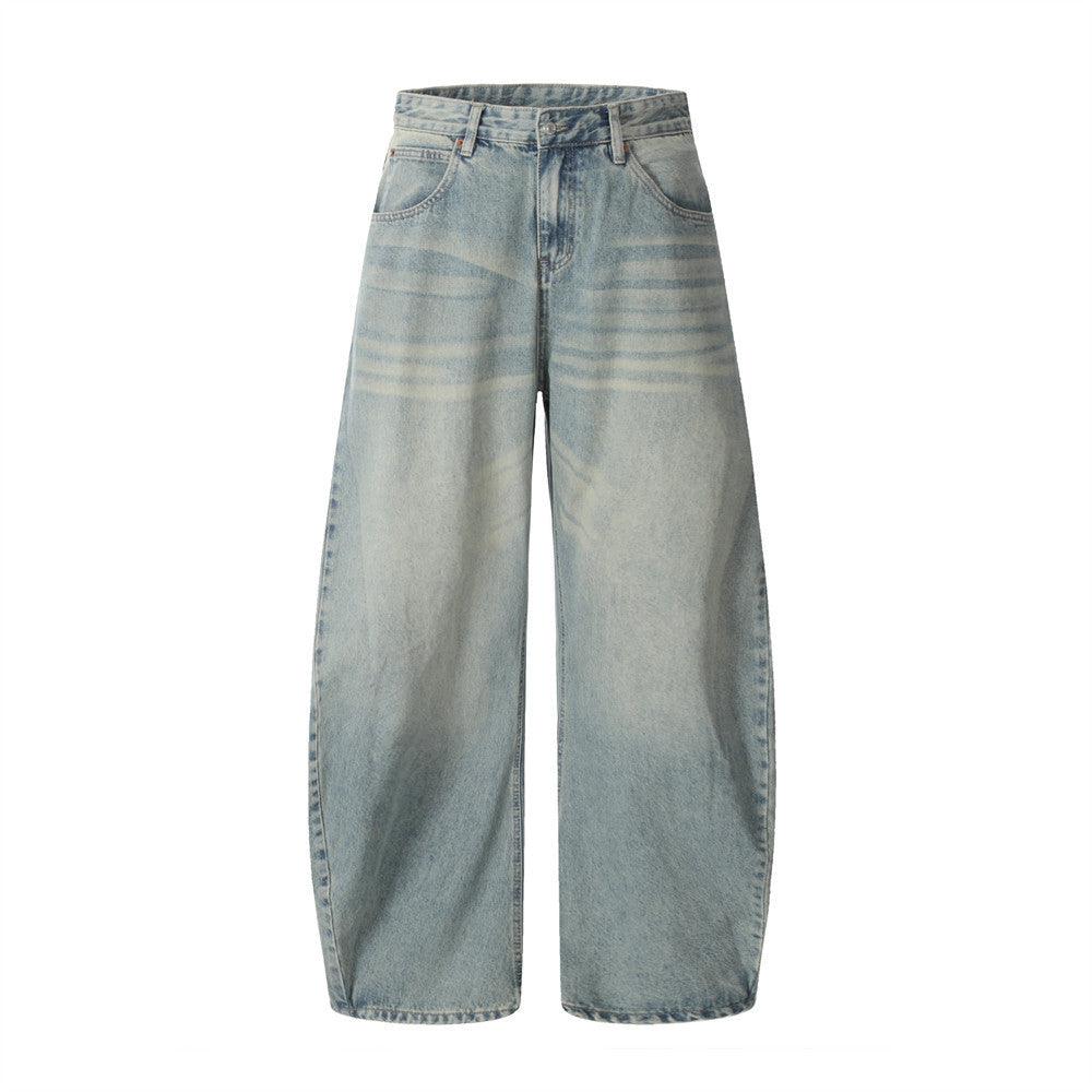 Blue wide-leg wash denim trousers with front fly and wide relaxed legs