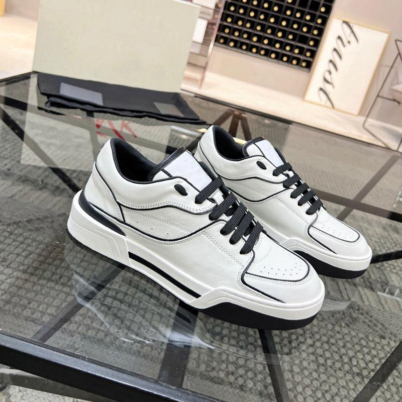 Black and white lace-up leather sneakers with black laces and white rubber sole