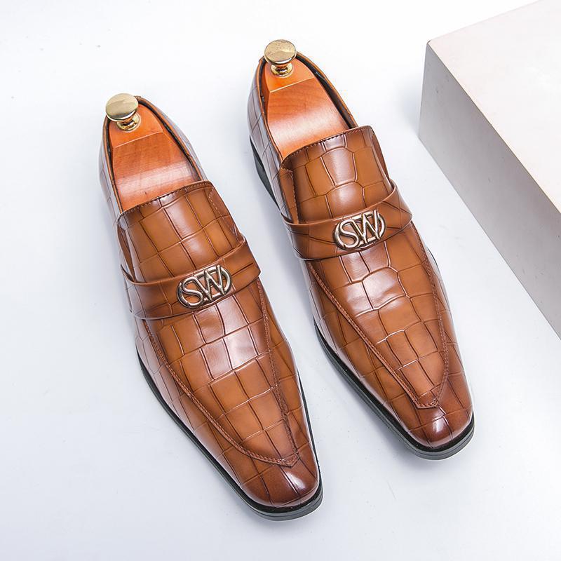 Pair of brown croc-textured pointed slip-on loafers with gold logo strap