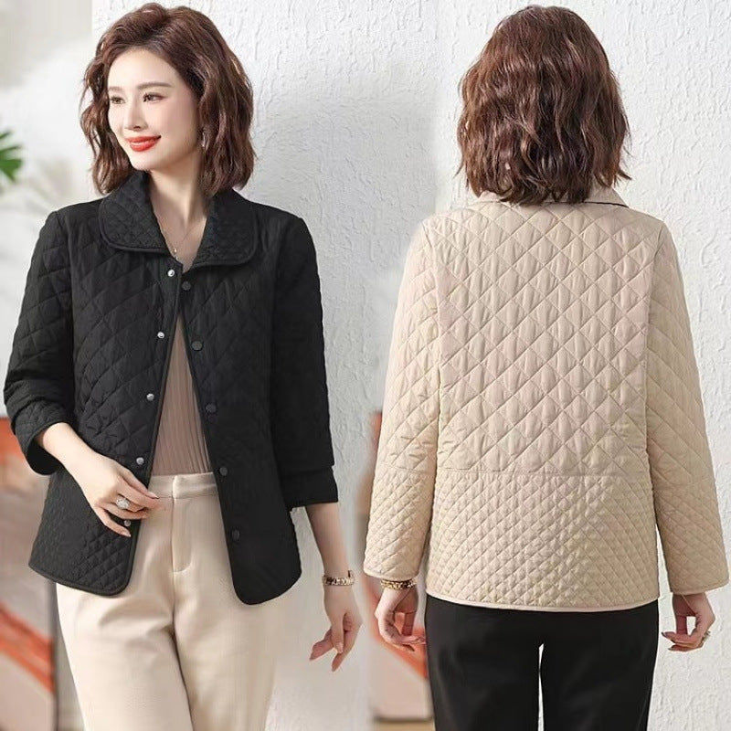 Black quilted short jacket with button front and stand collar