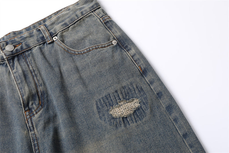 Modische Jeans mit Löchern und Patches für Männer