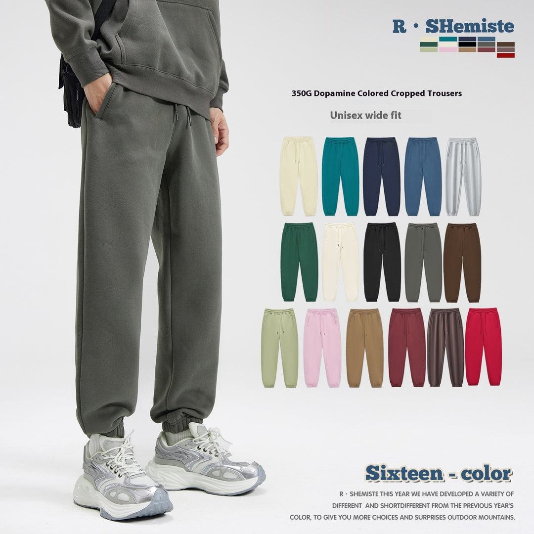 Dark gray fleece ankle-tied sweatpants with elastic waistband and drawstring cuffs
