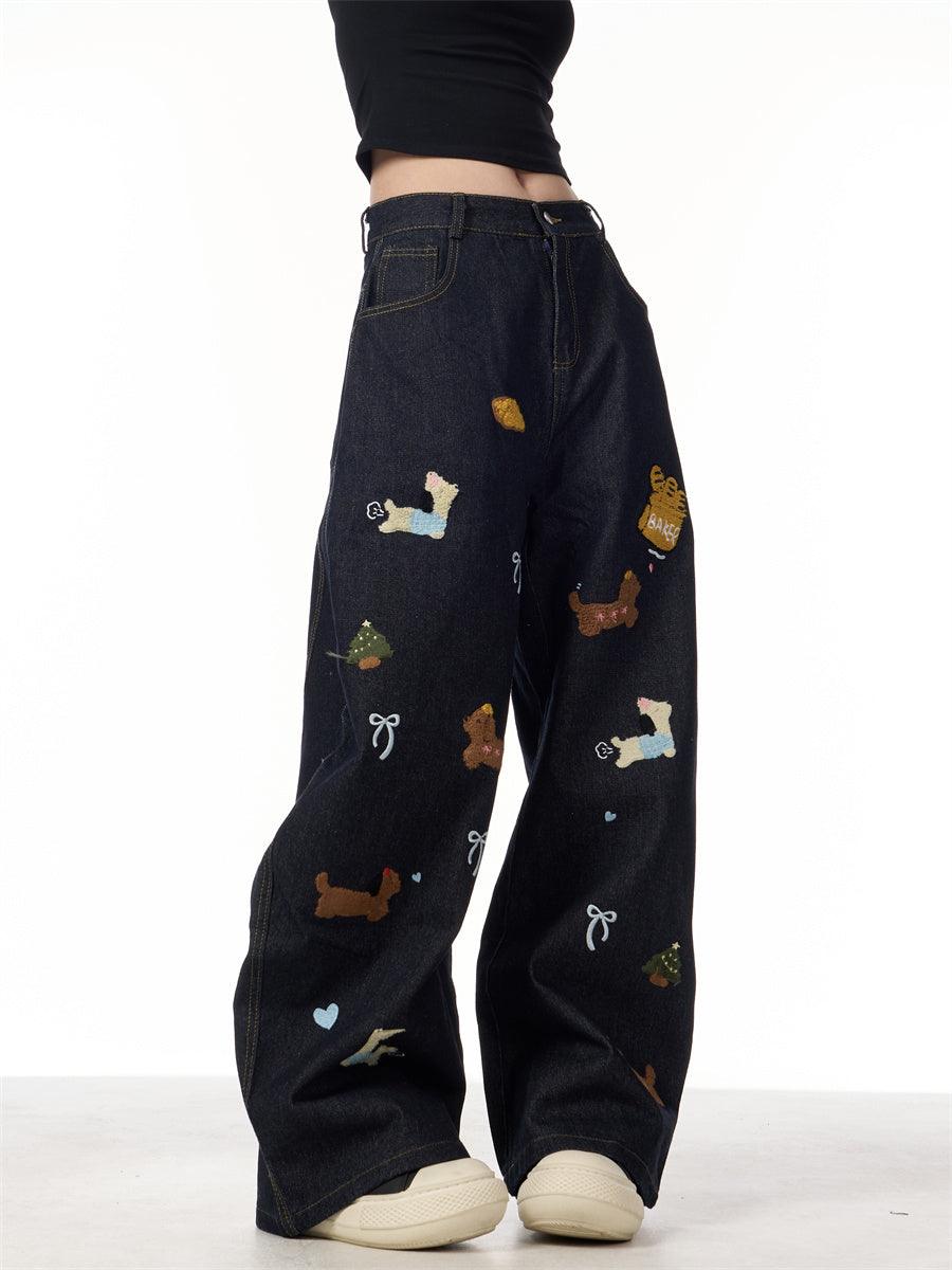 Black wide-leg patchwork jeans with multicolor dachshund prints and heart details
