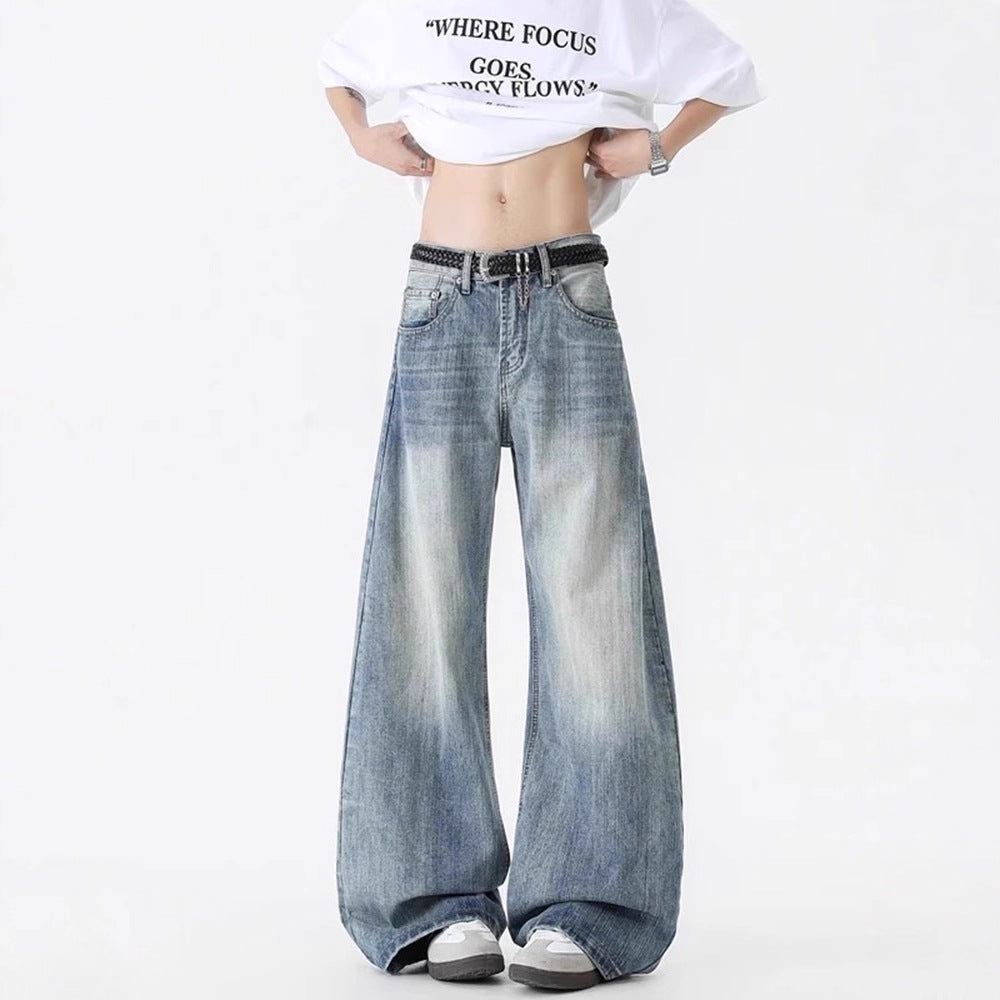 Blue washed distressed denim wide-leg pants with elastic waist and oversized fit