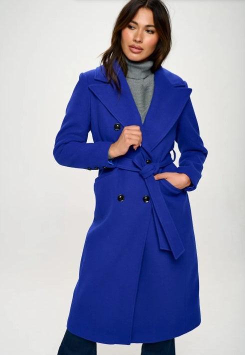 Royal blue longline double-breasted coat with belt, notched lapels, black buttons.