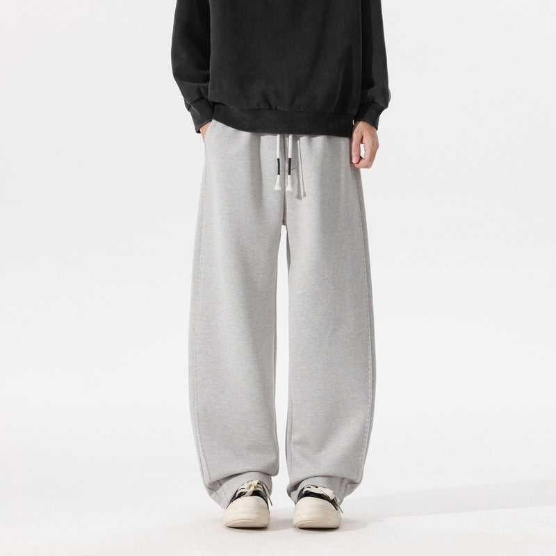 Men's heather gray casual jogger pants with drawstring waist and relaxed wide fit