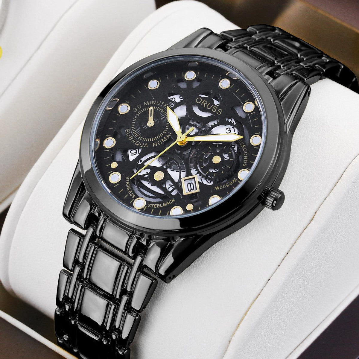 Black automatic skeleton wrist watch with black dial and black metal link bracelet