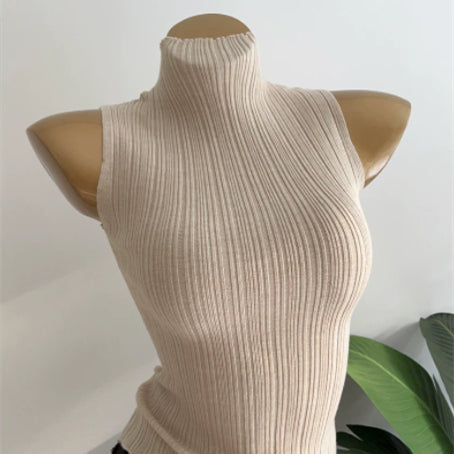 Apricot ribbed sleeveless mock-neck slim-fit top, high collar and fitted knit.