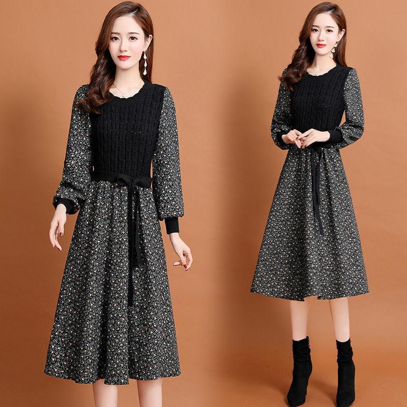 Women's long-sleeve knitted dress worn with black floral midi skirt and dark ribbed knit top