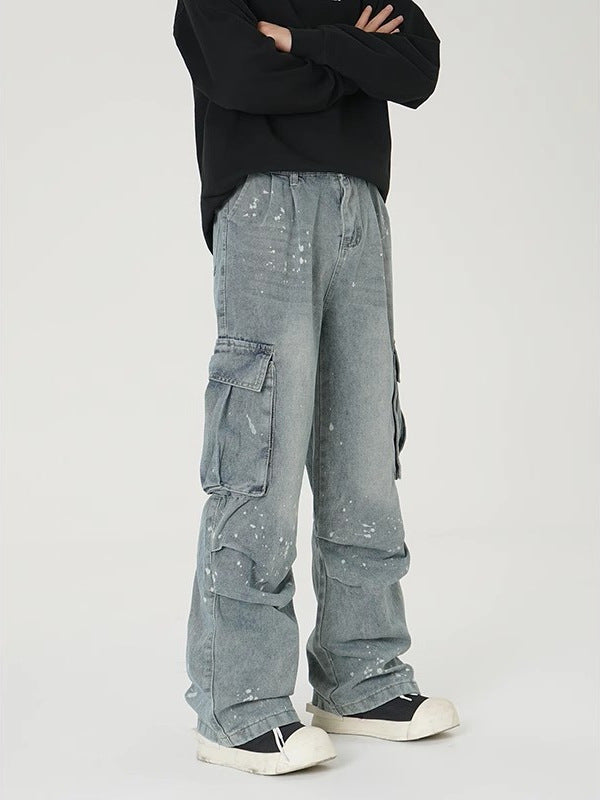 Light blue washed wide-leg denim work pants with cargo pockets and speckled finish