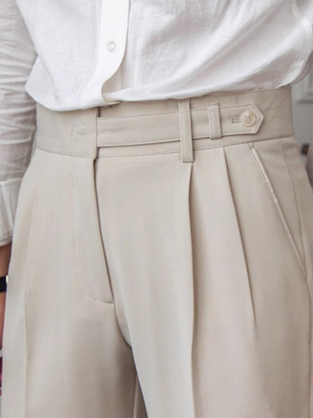 Apricot pleated front casual pants with belt loops and side pockets