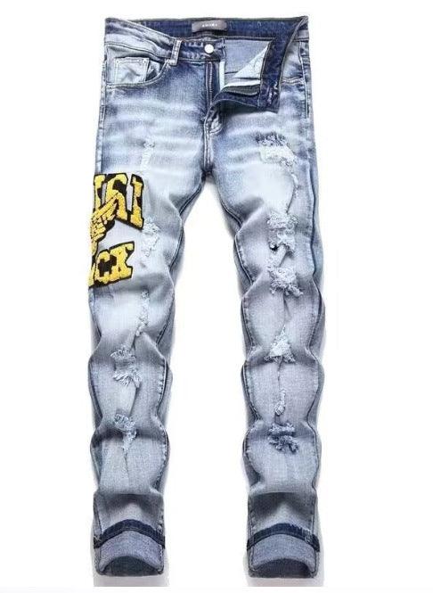 Men's slim ripped jeans in blue wash with yellow graphic print on left leg