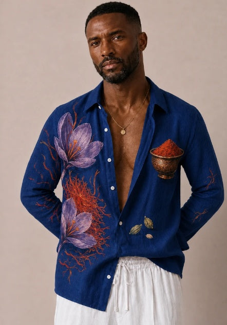 Blue oversized button-up shirt with spice and floral print, long sleeves, chest pocket