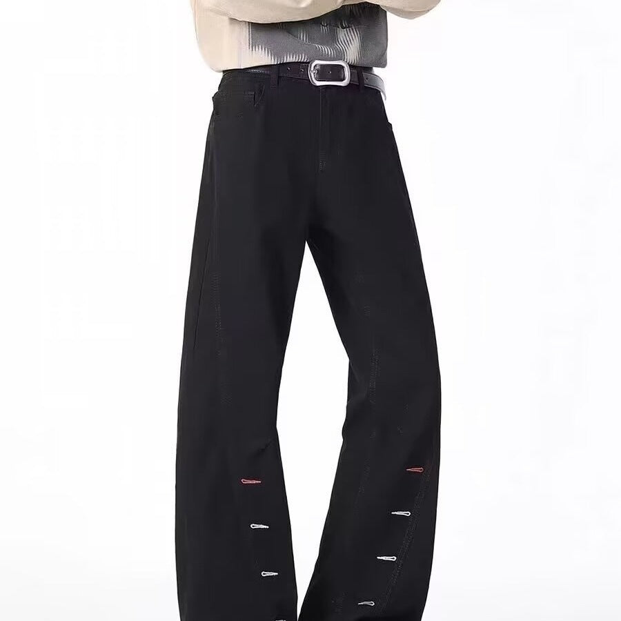 Men's black bootcut jeans with button-fly and side zipper, back view