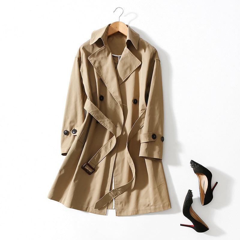 Khaki long windbreaker jacket with tie belt, storm flap, and button cuffs
