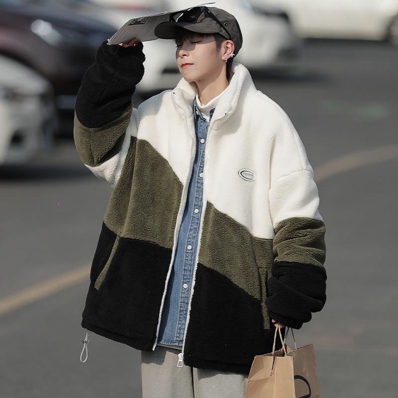 Color-block zip-up jacket in white, black, and olive with chest oval logo patch