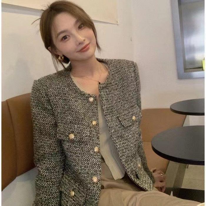 Women's short tweed coat with gold button placket and structured V-neck opening