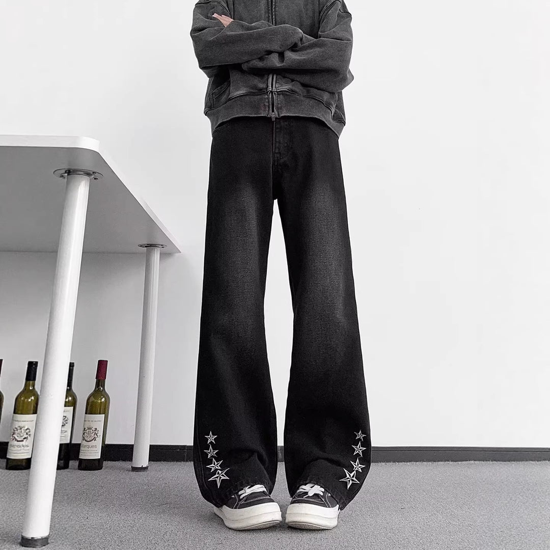Men's black straight-leg jeans with star embroidery at cuffs and wide hem