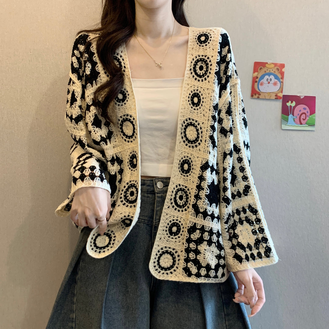 Black hollow-out crocheted long-sleeve cardigan with circular motif border, open front