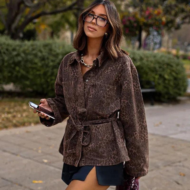 Brown animal-print lapel coat with button front, tie belt, and flap pockets, long sleeves